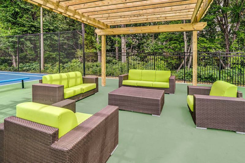 Lime green couches under a pergola
